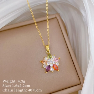 Detail view of colorful flower pendant with sparkling crystals on gold titanium chain
