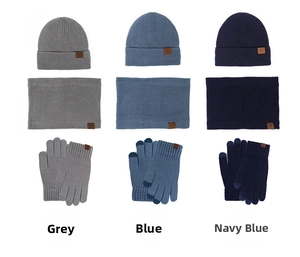 Close-up of ribbed knit texture on winter beanie and touch-screen gloves with leather labels