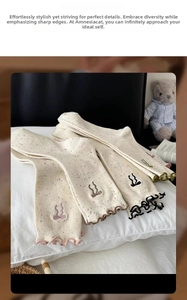 Detailed view of beige confetti crew socks with scalloped edges and cute bow embroidery