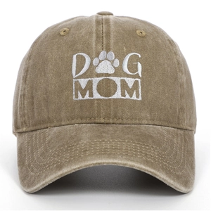 Close-up of khaki washed cotton baseball cap with white DOG MOM embroidery and paw print