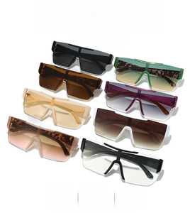 Flat lay of rimless shield sunglasses in eight diverse colors for trendy outdoor wear