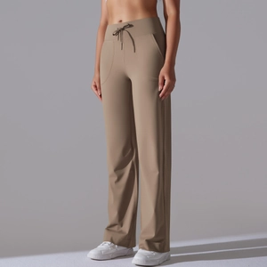 Detail of high-waist khaki wide-leg yoga pants with drawstring and functional pockets