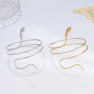 Exaggerated vintage snake-shaped spiral arm cuff in gold and silver finish alloy