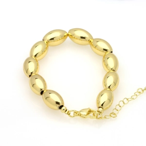 Detail of 18k gold plated bead bracelet with lobster clasp and adjustable extension chain