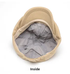 Detailed interior of khaki newsboy cap showing grey fabric lining and sweatband quality