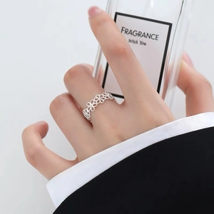Elegant hollow floral silver ring for women with minimalist open adjustable band design