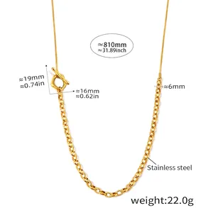 Detail view of gold two-tone OT buckle sweater chain with bold ring and snake bone links