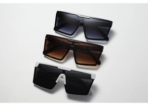 Three pairs of square oversized sunglasses in black, tortoiseshell, and white frames