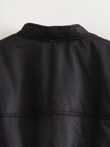 Detail of neckline and horizontal stitching on back of black windproof flight jacket