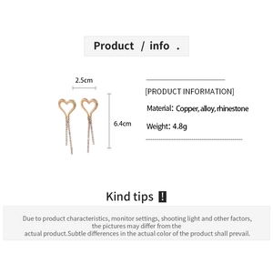 Detail view of heart-shaped tassel earrings with exact size and material specifications
