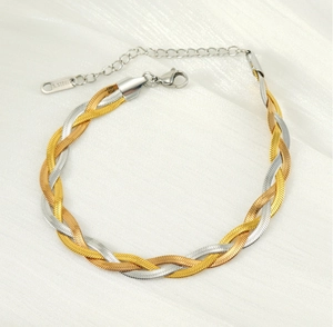 Detail of tricolor braided stainless steel bracelet with lobster clasp and extender chain