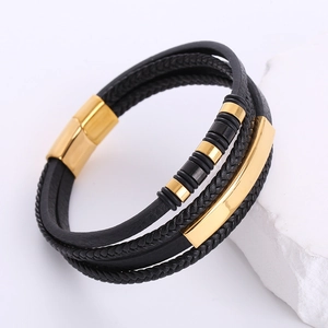 Men's multilayer braided black leather bracelet with gold magnetic clasp on white stone