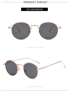 Detail view of vintage round sunglasses with slim gold metal frames and black lenses