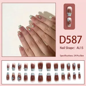 French green and brown gradient press-on nails with silver rhinestones and star patterns