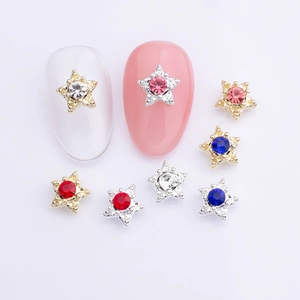 Star-shaped nail art charms with colorful rhinestones in gold and silver alloy base