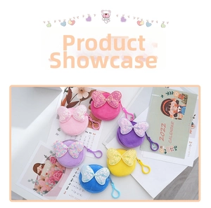 Detail of six colorful plush coin purses with sequin bows and plastic spring clips