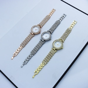 Detailed trio of rose gold, silver, and gold quartz watches with full rhinestone pavé setting