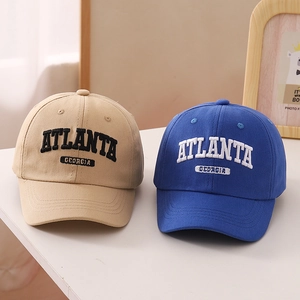 Detailed close-up of premium cotton baseball caps with high-quality Atlanta 3D embroidery
