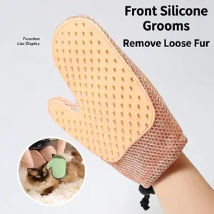 Pink pet grooming glove for cat massage, bathing, and hair removal with wrist drawstring