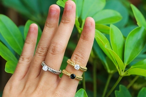 Three beaded zircon rings in silver and gold with sparkling white and black stones