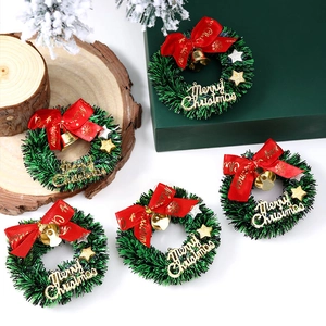 Set of 5 mini Christmas wreaths with red bows, golden bells and stars for holiday decor