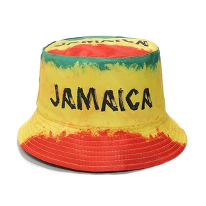 Detail of Jamaica bucket hat with tie-dye stripes and bold black text on white background