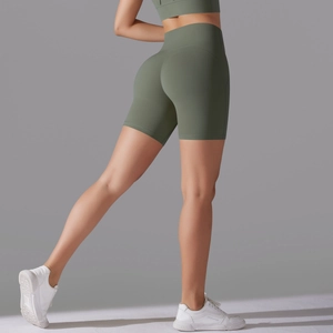 Detail of olive green high-waisted yoga shorts with seamless butt lifting design
