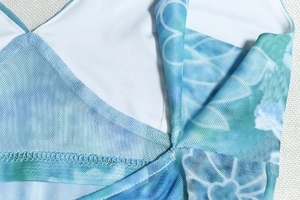 Detail of blue printed mesh top featuring double-layer stitching and breathable fabric