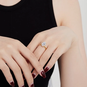 Detail view of oval cut ice flower radiant cubic zirconia ring on female hand