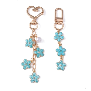Sweet pearl cherry blossom keychain with gold metal flowers and blue enamel finish