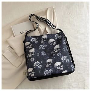 Detail of nylon crossbody bag with skull flower print and white LOVE lettered strap