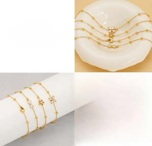 Detailed views of gold titanium steel bracelets with star, flower, and bow zircon charms