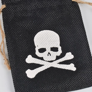 Halloween burlap drawstring gift bag with white skull and crossbones print for party candy