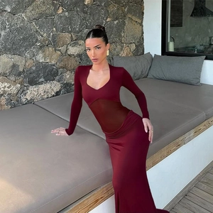 Detail of burgundy ruched maxi dress with sheer mesh waist panel and elegant ruffles
