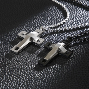 Detail of hip hop double-layer cross pendants in silver and matte black metal finish