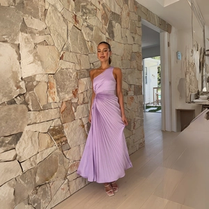 Detailed view of lavender one shoulder pleated dress with elegant satin texture and side drapes