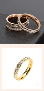 Macro detail of rose gold and gold titanium rings with rows of clear cubic zirconia