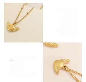 Detailed macro view of 18k gold plated surgical titanium steel wing pendant