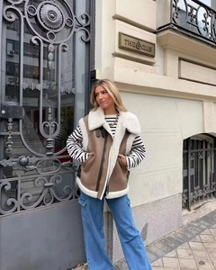 Detail of Y2K brown faux shearling vest with plush lining and zipper closure