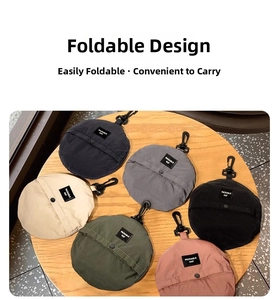 Detailed view of six packable sun hats folded with hooks in multiple colors