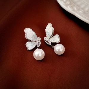 Elegant silver butterfly earrings with sparkling crystals and a white hanging pearl