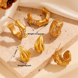 Golden titanium steel earrings set with geometric shapes and sparkling zircon accents