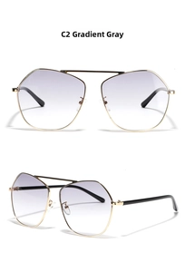 Detailed view of polygon metal sunglasses with gradient grey lenses and gold double bridge frame