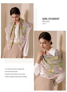 Detail of silk scarf with floral print and glossy texture on a light beige background