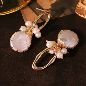 Elegant natural freshwater pearl earrings with gold wire wrap in a vintage French style