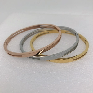 Titanium steel bangles in gold, rose gold and silver with hollow rectangular stripes