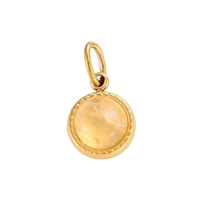Detailed view of round gold plated pendant with yellow stone for jewelry making