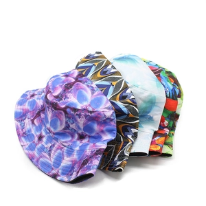 Five reversible camouflage bucket hats in various floral and geometric patterns