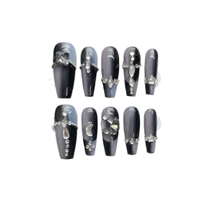 Dark gothic coffin press-on nails with black cat eye effect and silver cross charms