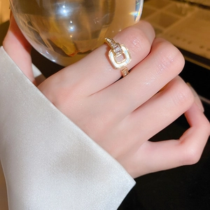 Elegant gold square geometric open ring with white inlay and zircon accents on model hand